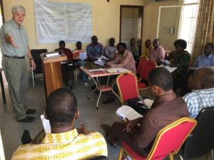 Pastor Mike teaching group in French